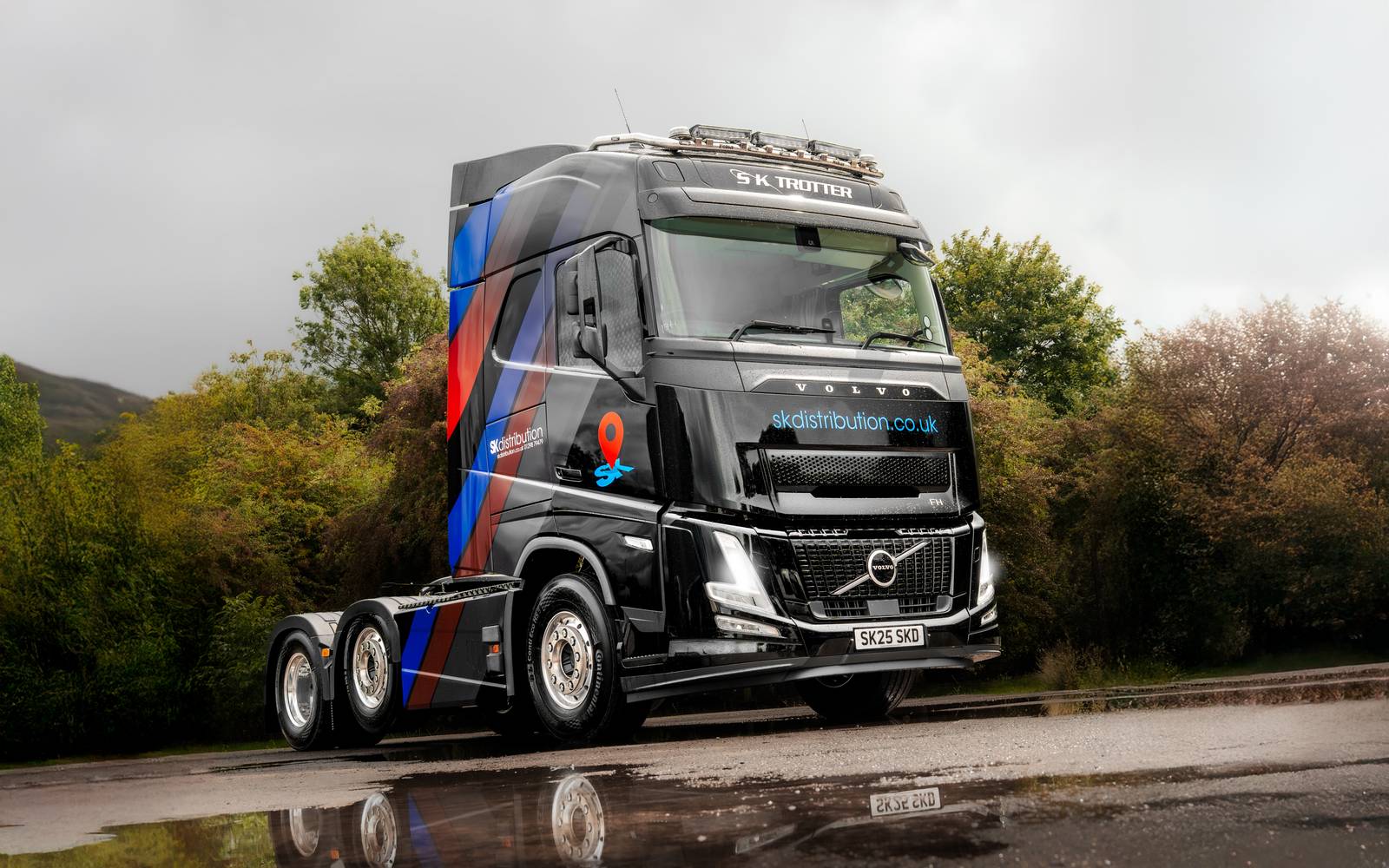 SK Distribution's new black Volvo FH fleet
